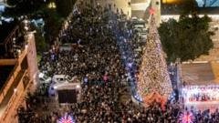 Bethlehem Christmas tree illuminated for first time since Gaza war began Bethlehem Christmas tree illuminated for first time since Gaza war began