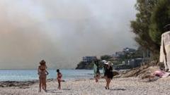 thousands evacuated in crete as wildfires threaten tourist resorts